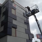 Permalink to Commercial Building Washing Vancouver washing signage and high wall section from Z80 lift
